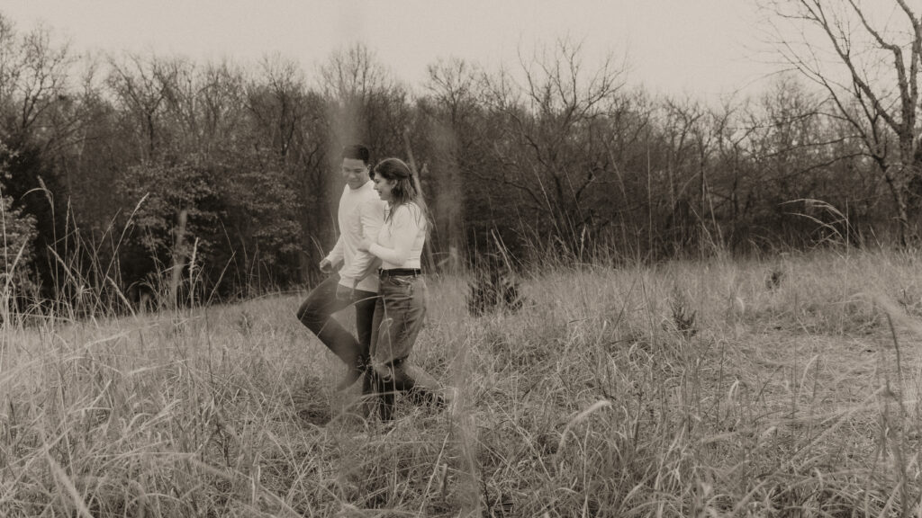 Young couple takes a walk in the field.
