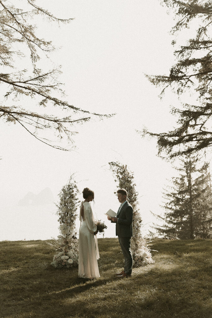 Bride and groom recite vows to one another during their dreamy Crook Point elopement in Oregon.
