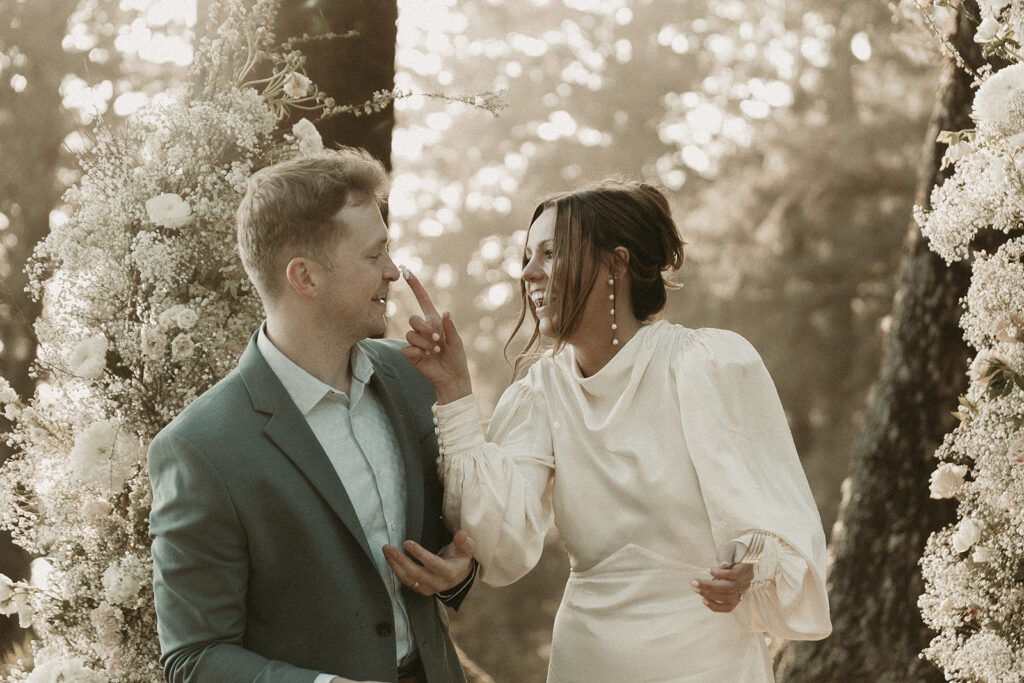 Bride and groom cut into a cake at their dreamy Crook Point elopement in Oregon.