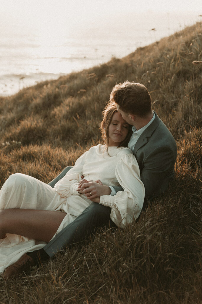 Bride lays into groom during dreamy sunset cliff elopement photos at Crook Point, Oregon.