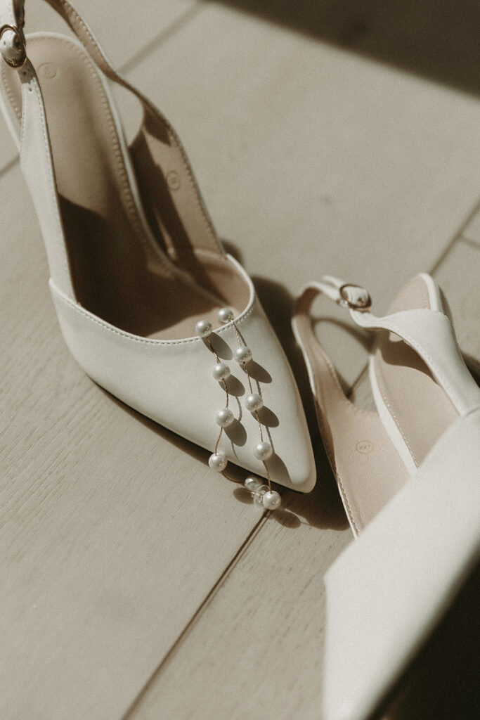 Wedding heels with pearl earrings for an Oregon elopement.