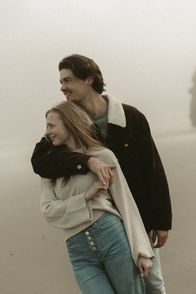 Young couple explores Gold Beach, Oregon.