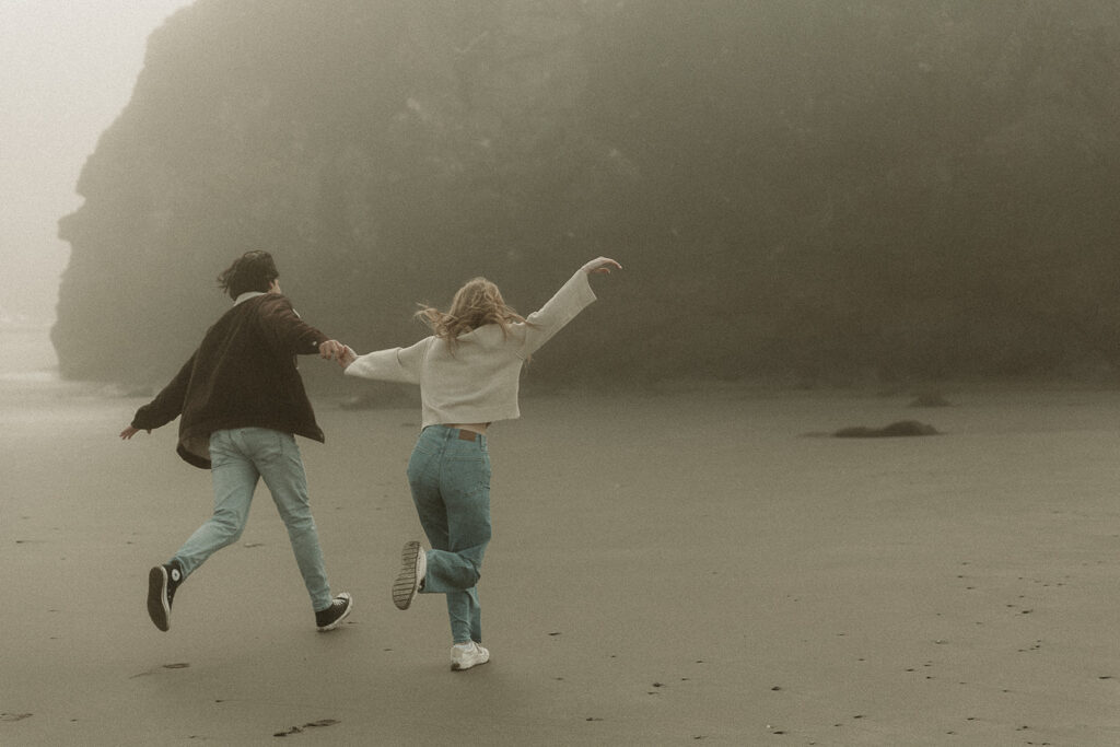 Young couple explores Gold Beach, Oregon.