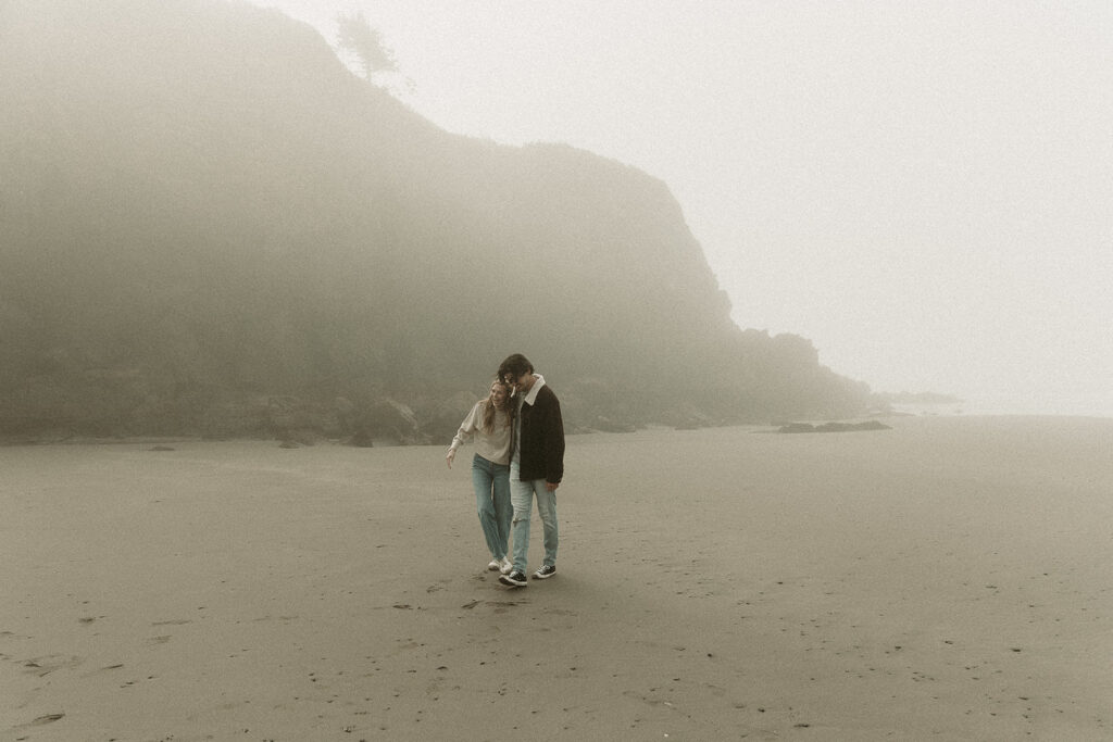 Young couple explores Gold Beach, Oregon.